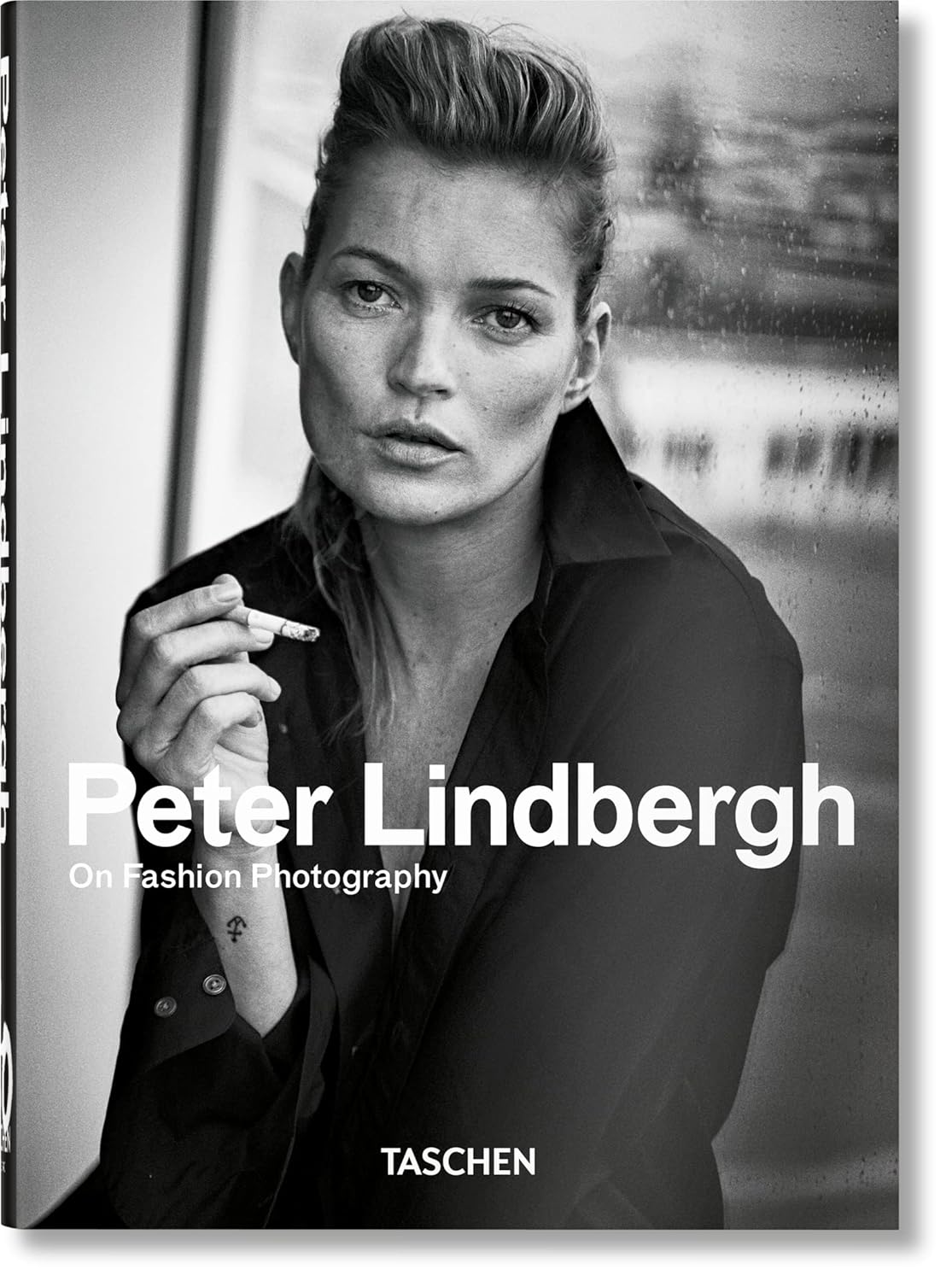 "Peter Lindbergh's 1988 White Shirts series shot on a Malibu beach, introducing supermodels Linda Evangelista, Christy Turlington, Rachel Williams, Karen Alexander, Tatjana Patitz, and Estelle Lefébure, marking a new era in fashion photography."